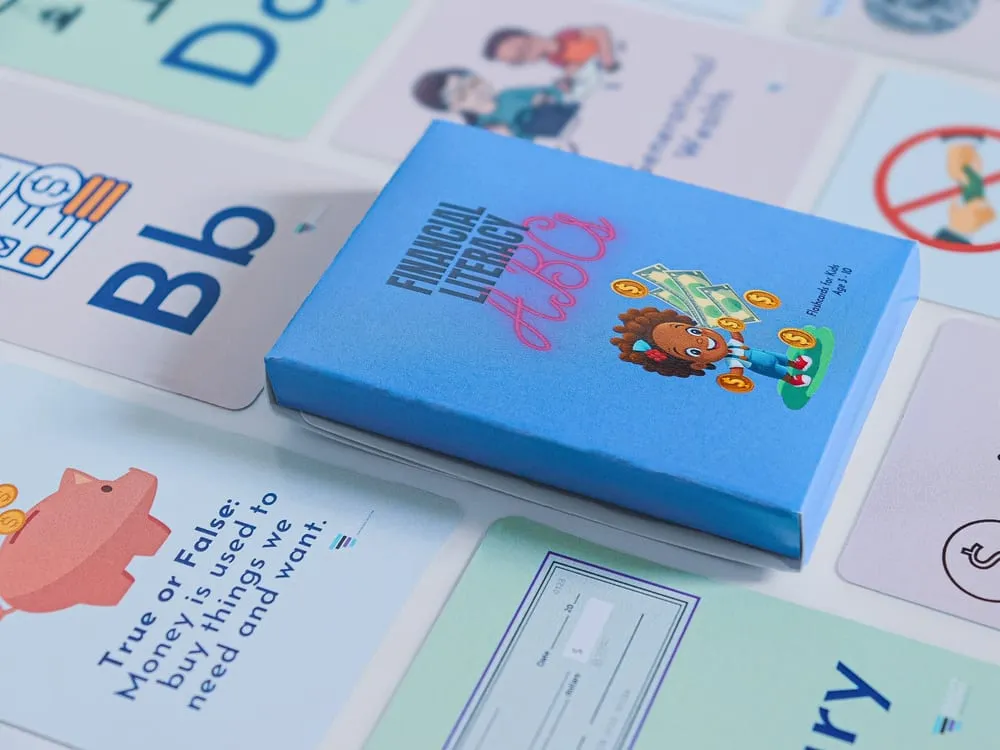 The Financial Literacy ABCs flashcard box with cards fanned around it